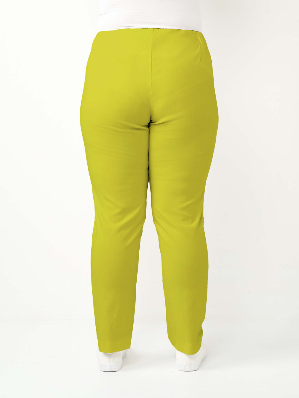 back view of a woman wearing a vibrant lime green bengaline pant in full length straight leg