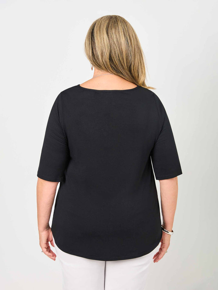 back view of woman wearing a plain black classic tee with three-quarter sleeves