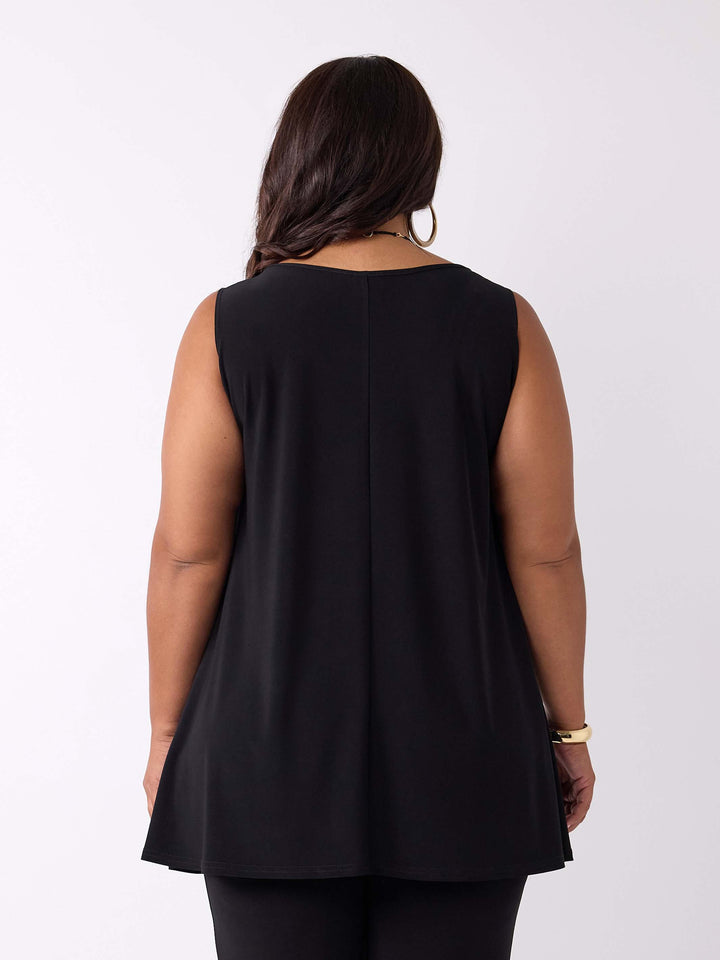 A woman viewed from the back wearing a sleeveless black top 