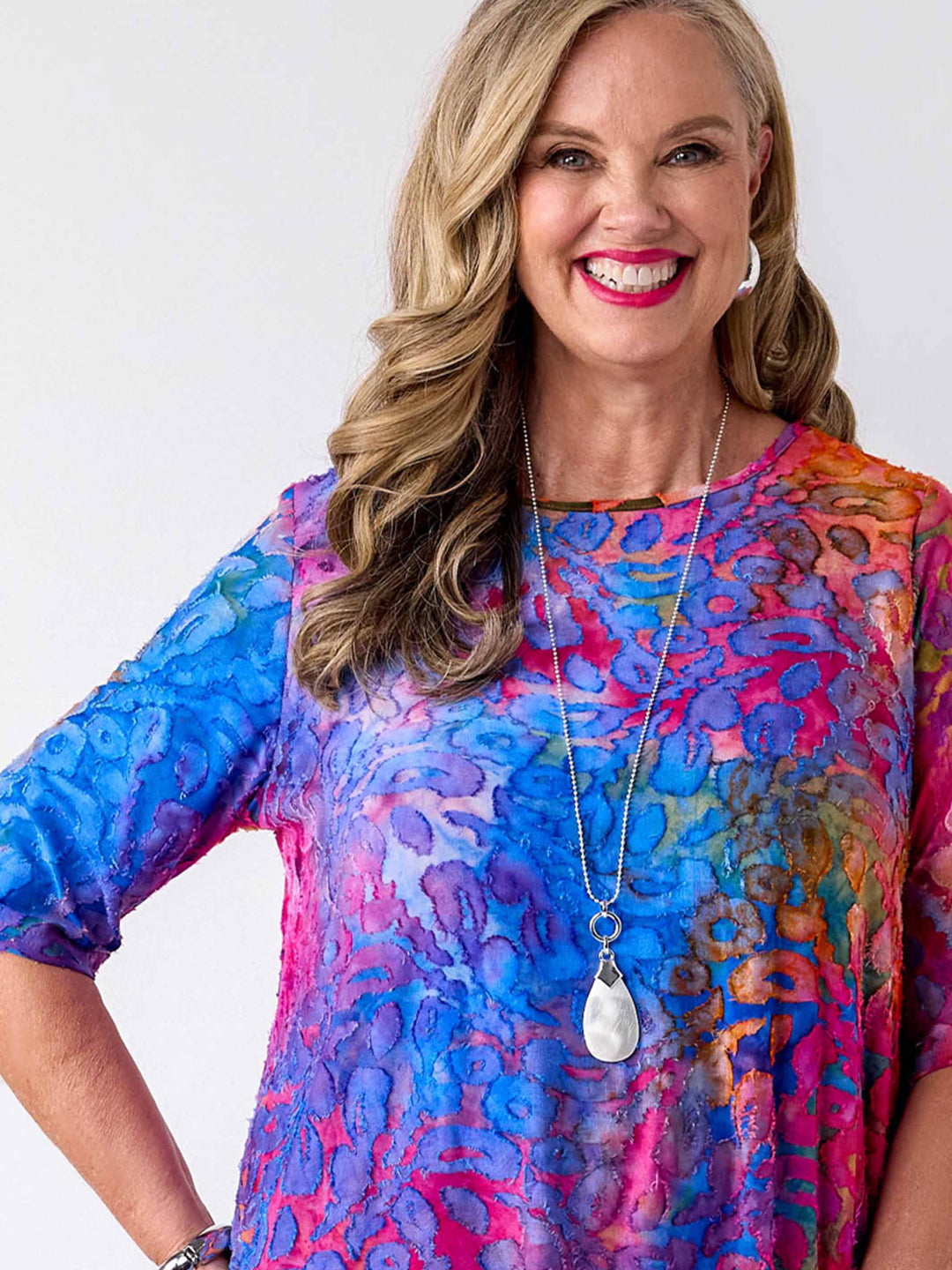 detail view of a colourful swing jersey top with blue and pink tone print with burnout detail