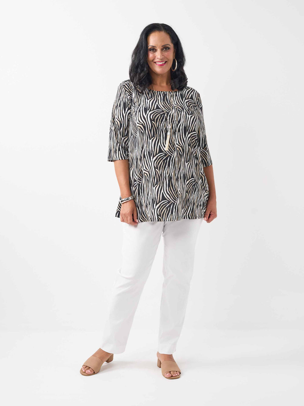 model wearing a black, brown and white zebra-print square neck jersey top with three-quarter sleeves