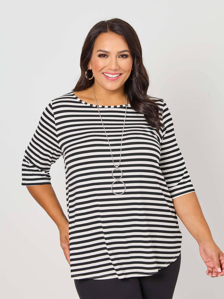 A woman wearing a black and white striped short-sleeve top with a boat neckline