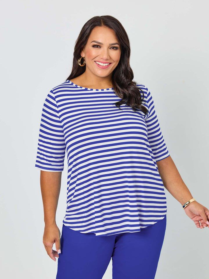 A woman wearing a short-sleeve top with light navy blue and white stripes