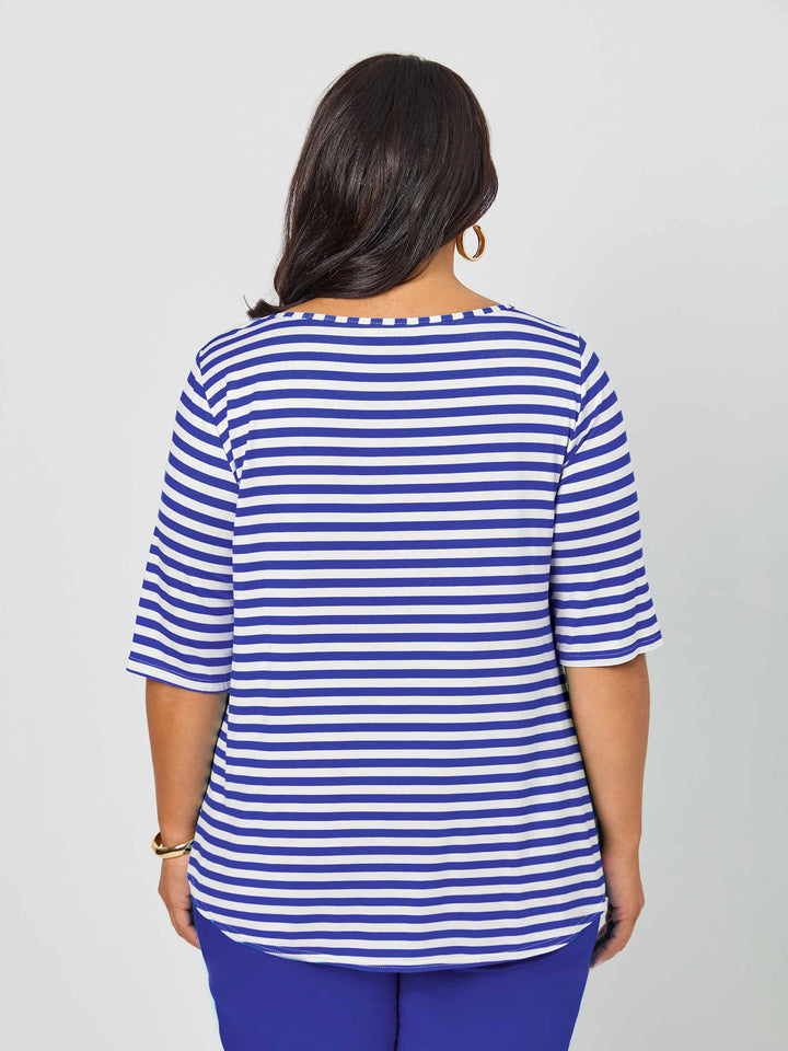 Back view of a woman wearing a short-sleeve top with light navy blue and white stripes