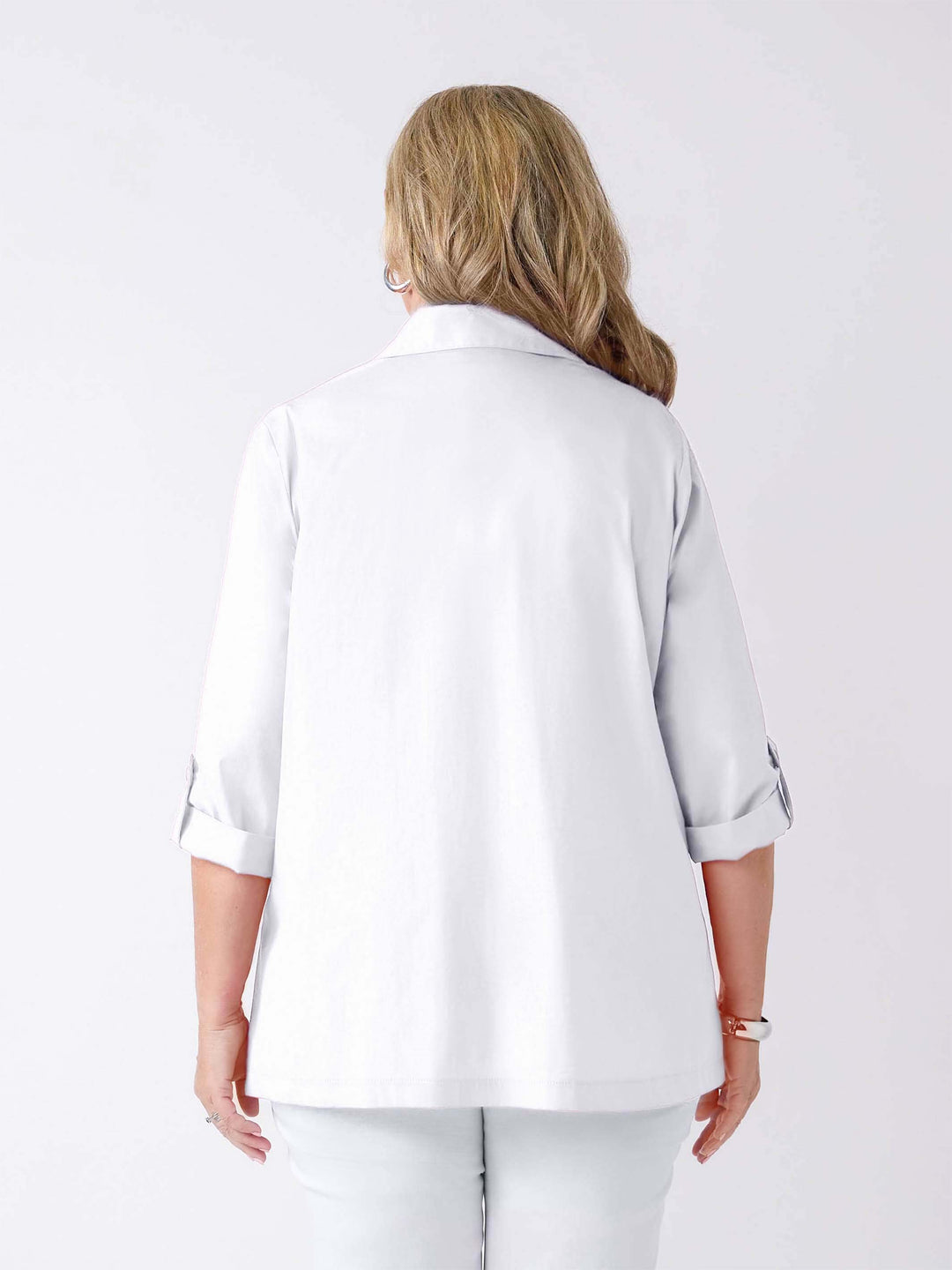back view of a woman wearing a white tab sleeve collared shirt