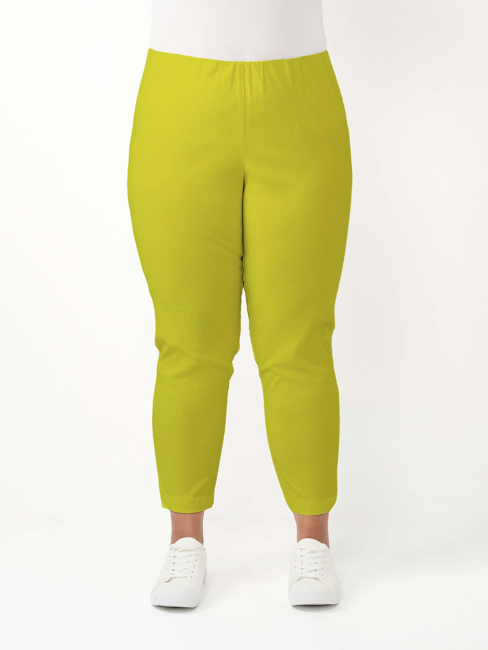 A woman wearing bright citrus lime green cropped bengaline pants