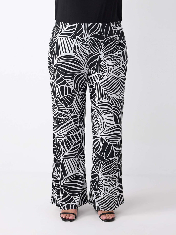 Black and white tropical leaf print wide-leg palazzo pants
