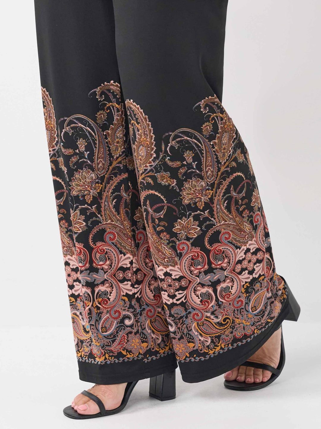 detail view of the boho inspired print on the black palazzo pant