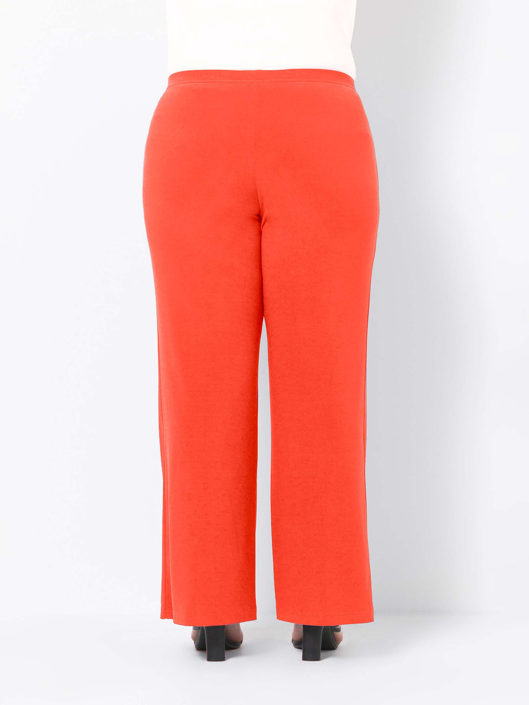 back view of bright orange wide-leg palazzo pants 