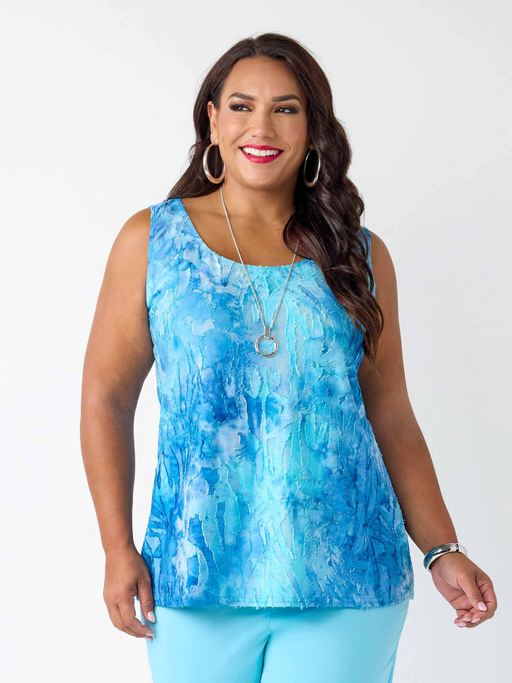 A woman wearing a blue tie-dye burnout cami