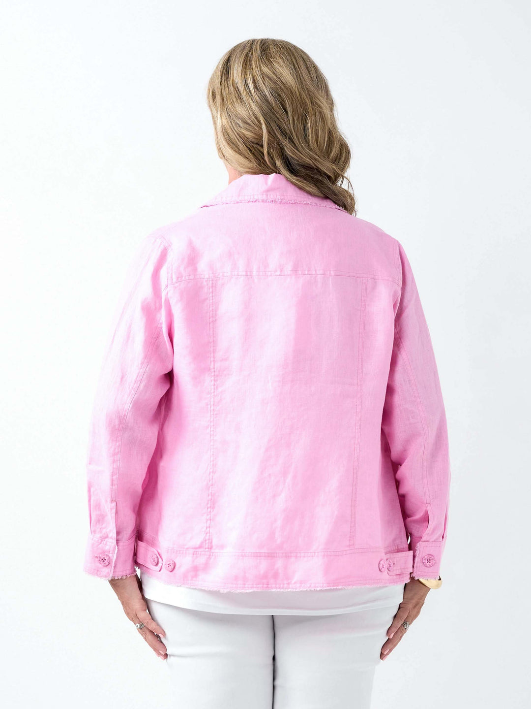 Back view of a woman wearing a lightweight pale pink linen jacket