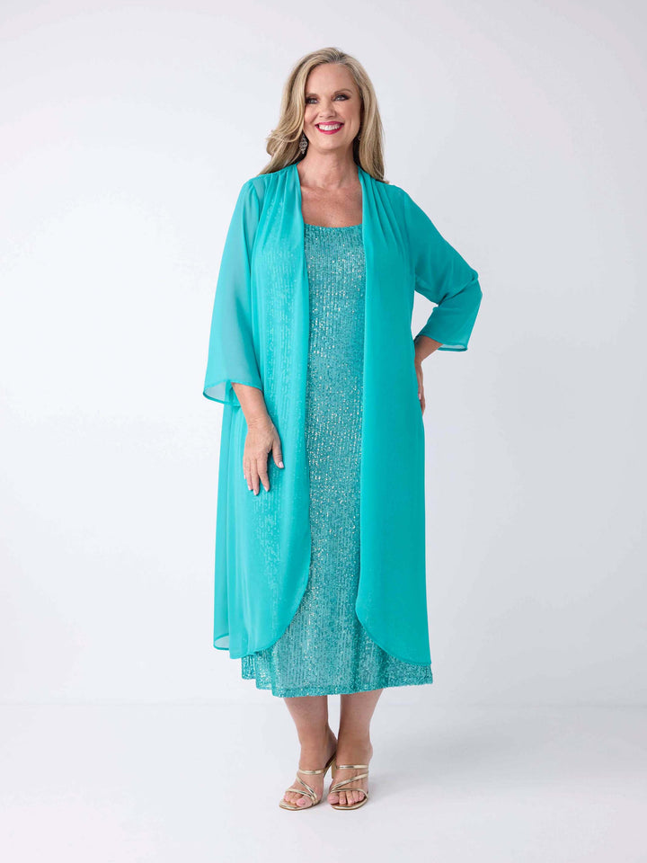 A woman wearing a turquoise blue sheer kaftan-style long jacket with a matching sequin maxi gown