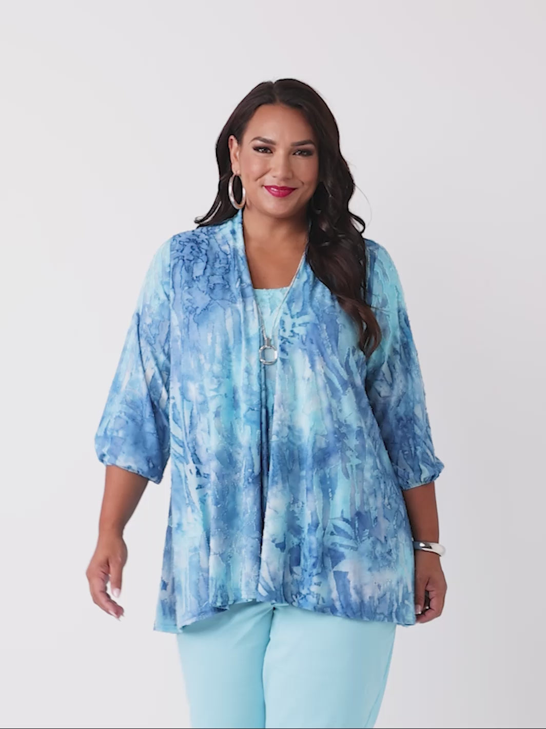 video of a woman wearing a blue tie-dye burnout jacket and cami set with three-quarter sleeves