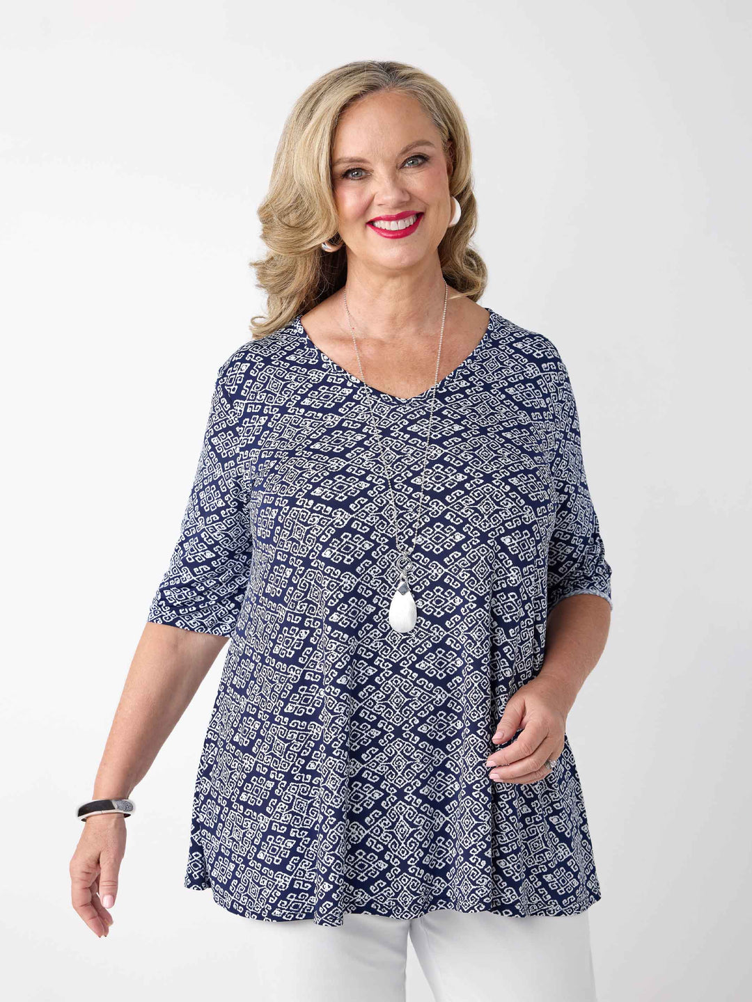 video of model wearing a navy v-neck swing jersey top with white print